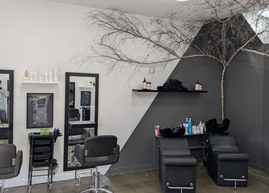 New Sensations Hairstyling in Melbourne, Victoria, AU features modern salon chairs and elegant decor.