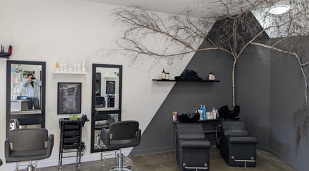 New Sensations Hairstyling in Melbourne, Victoria, AU features modern salon chairs and elegant decor.