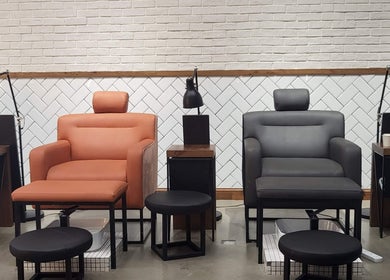 Comfortable nail salon chairs at We Nails Trident Grand Residence, Dubai, AE with stylish decor.