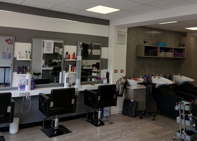 Interior of Diamonds and Pearls Hair Studio in Northfleet, England, GB with styling chairs and hair wash stations.