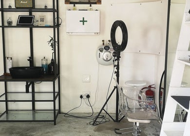 Sleek barber station at fiVe Hair Barber, Cape Town, Western Cape, ZA with a mirror, sink, and styling chair.