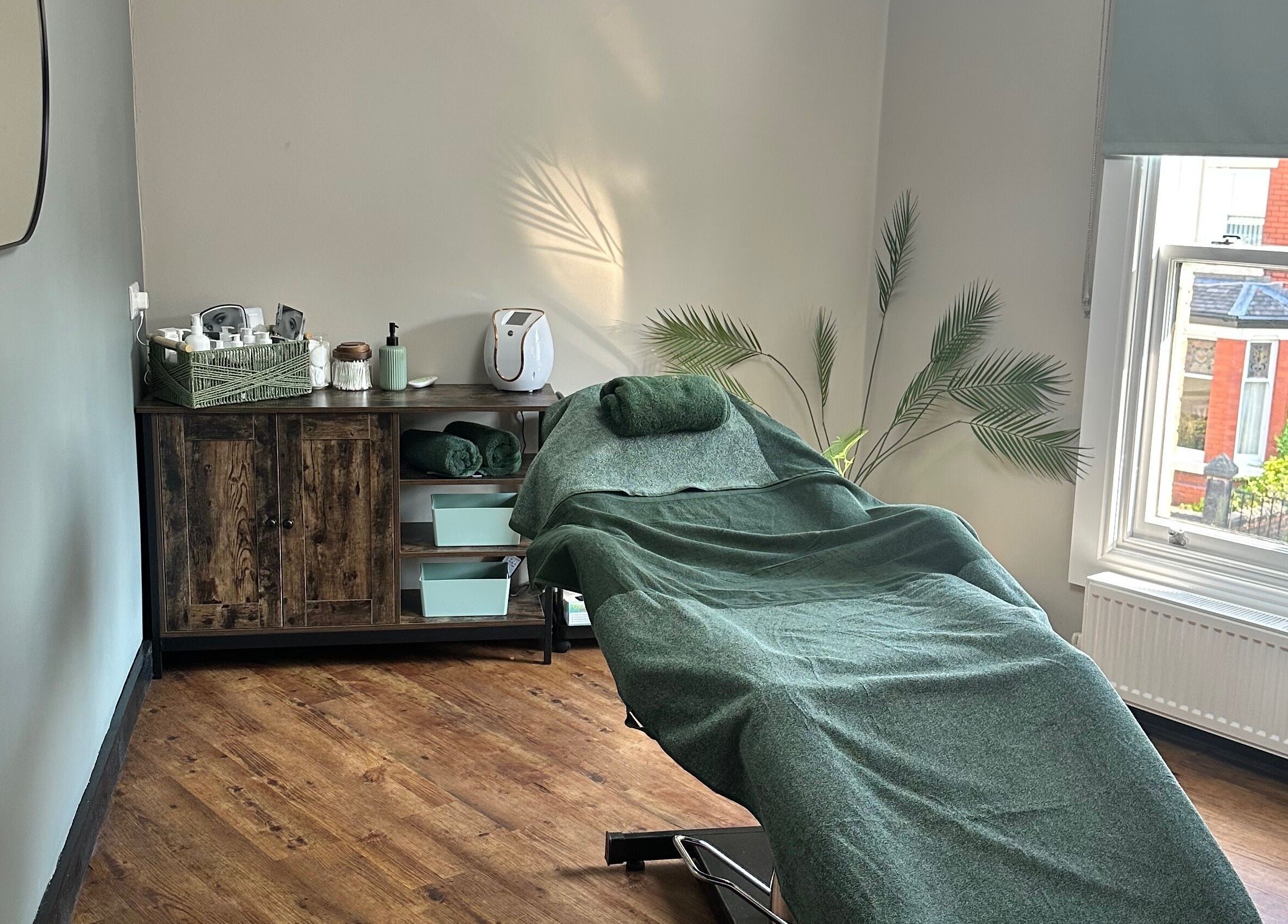 Relaxing treatment room at The Elite Retreat, Biddulph, SOT, England, GB with spa bed and soft lighting.