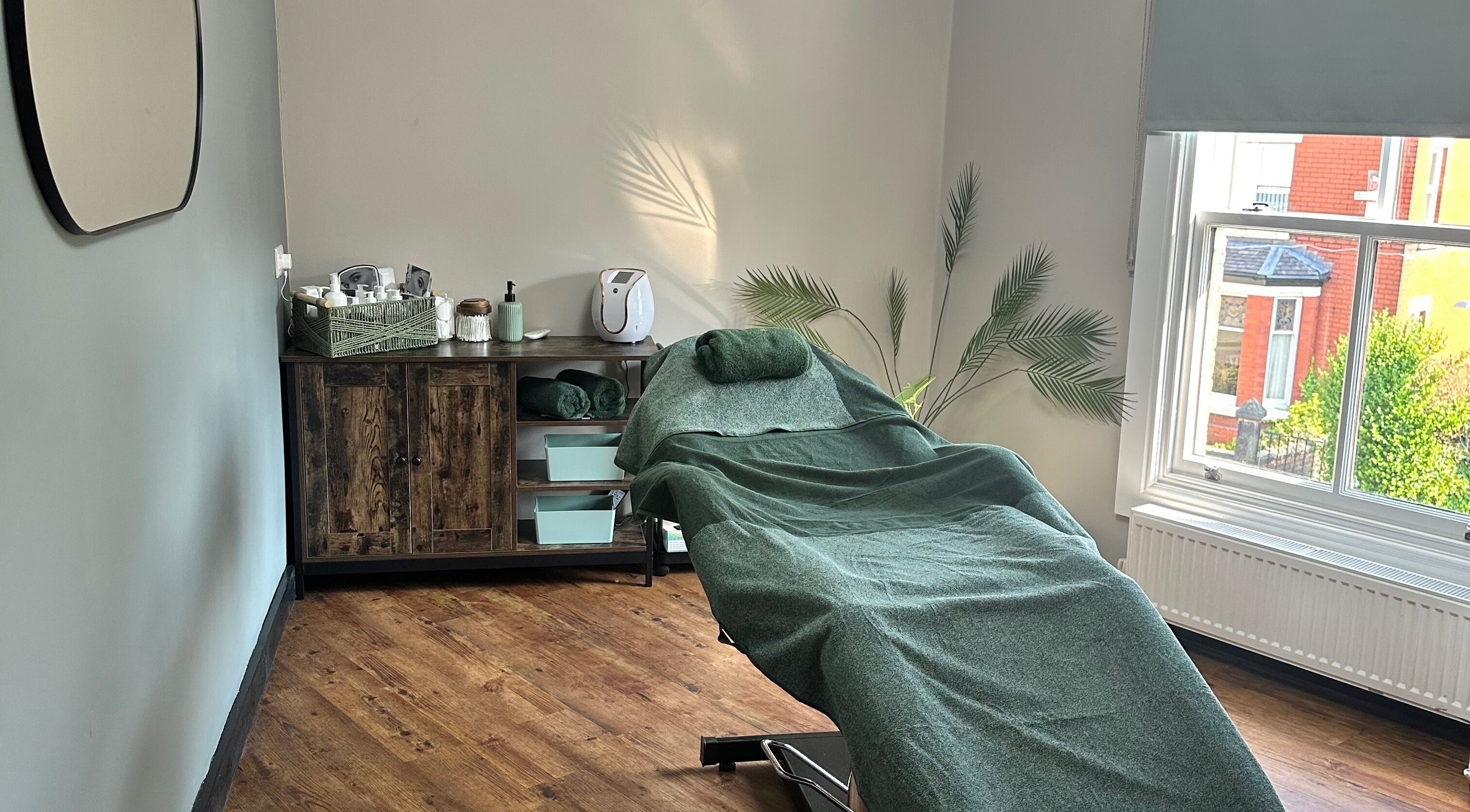 Relaxing treatment room at The Elite Retreat, Biddulph, SOT, England, GB with spa bed and soft lighting.
