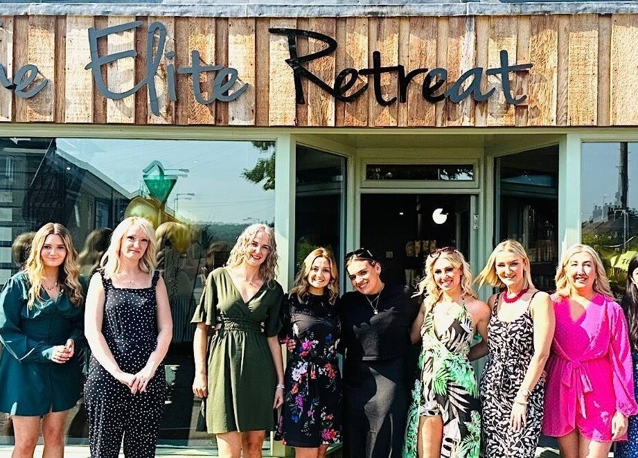 Group outside The Elite Retreat in Biddulph, SOT, England, GB, showcasing venue's welcoming atmosphere.