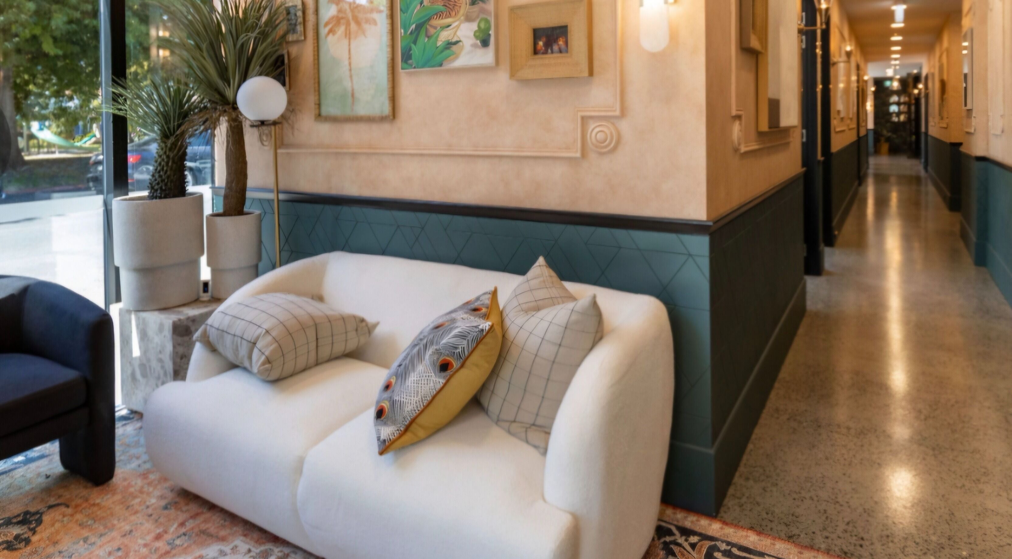 Inviting waiting area in Cut to the Chase, Prahran, Victoria, AU with chic decor and soft lighting.