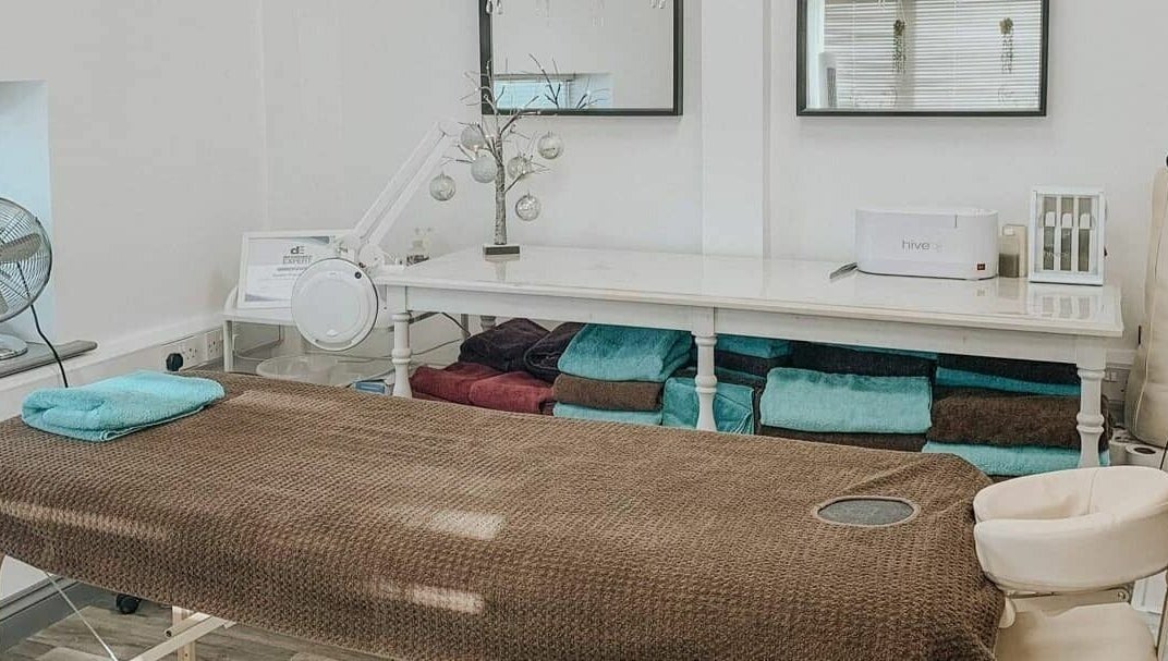 Relaxing therapy room at Remote Therapies, Shillingford, England, GB, featuring massage table and serene decor.