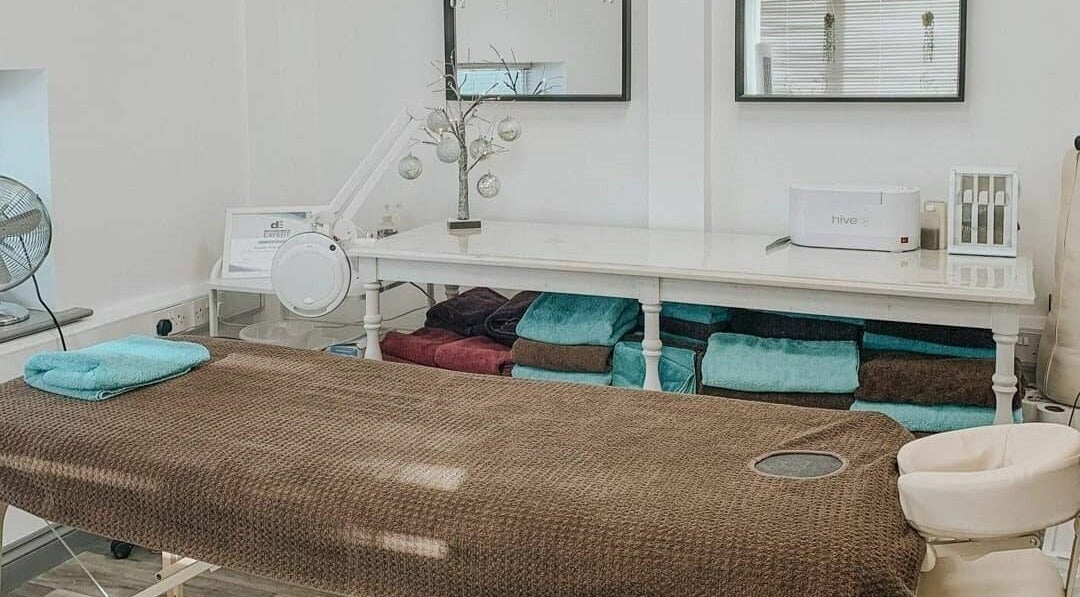 Relaxing therapy room at Remote Therapies, Shillingford, England, GB, featuring massage table and serene decor.