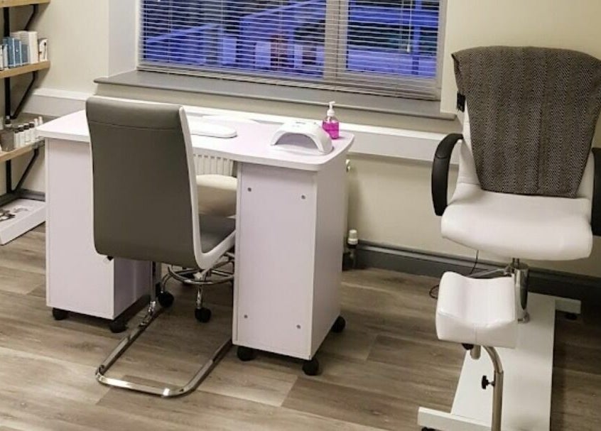 Modern therapy room at Remote Therapies, Shillingford, England, GB, featuring a manicure station and cushioned chair.