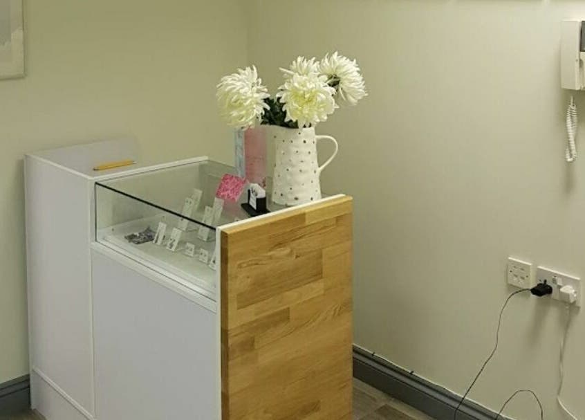 Elegant corner display at Remote Therapies, Shillingford, England, GB featuring a vase with flowers.