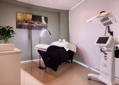 Elegant treatment room at Revive Beauty Clinic, Padstow, New South Wales, AU, featuring a cozy bed and modern equipment.