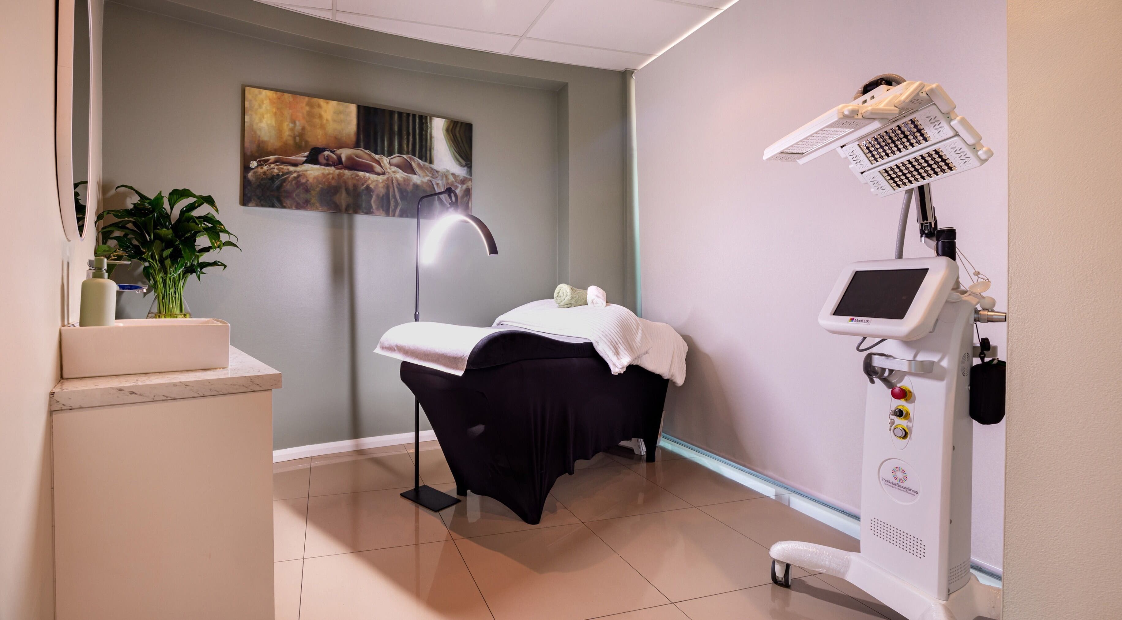Elegant treatment room at Revive Beauty Clinic, Padstow, New South Wales, AU, featuring a cozy bed and modern equipment.