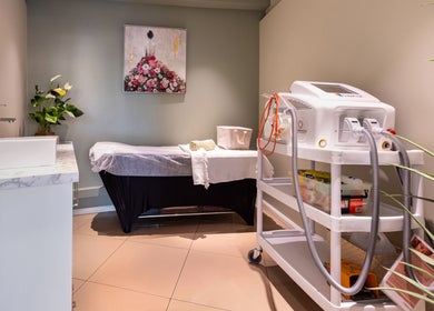 Serene treatment room at Revive Beauty Clinic, Padstow, New South Wales, AU, featuring a spa bed and equipment.