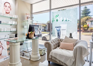 Elegant reception area at Revive Beauty Clinic, Padstow, New South Wales, AU, showcasing luxurious decor and beauty products.