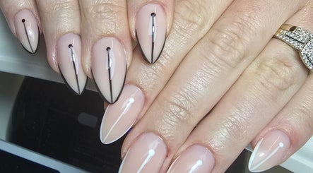 Stylish nude nails with black accents at Nails by Ashley, Bangor, Northern Ireland, GB.