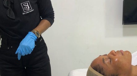Professional skin treatment at Skinjockey, Lagos, Lagos, NG, showcasing a client in a serene spa setting.