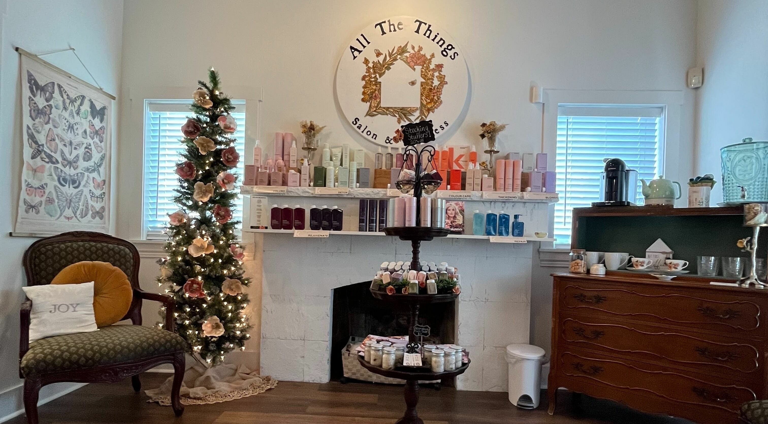 All The Things Salon and Wellness, Fort Myers, Florida showcases a festive, elegant interior with products and decor.
