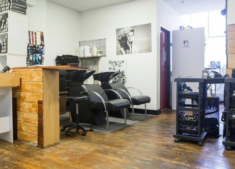 Modern salon interior with styling stations at Eton Place of Hairdressing, Sydney, New South Wales, AU.