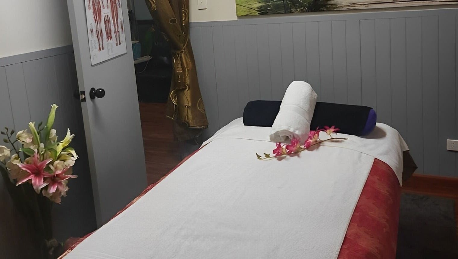 Relaxing massage room at Beyonder Relax and Wellness, Paradise Point, Queensland, AU with fresh flowers.