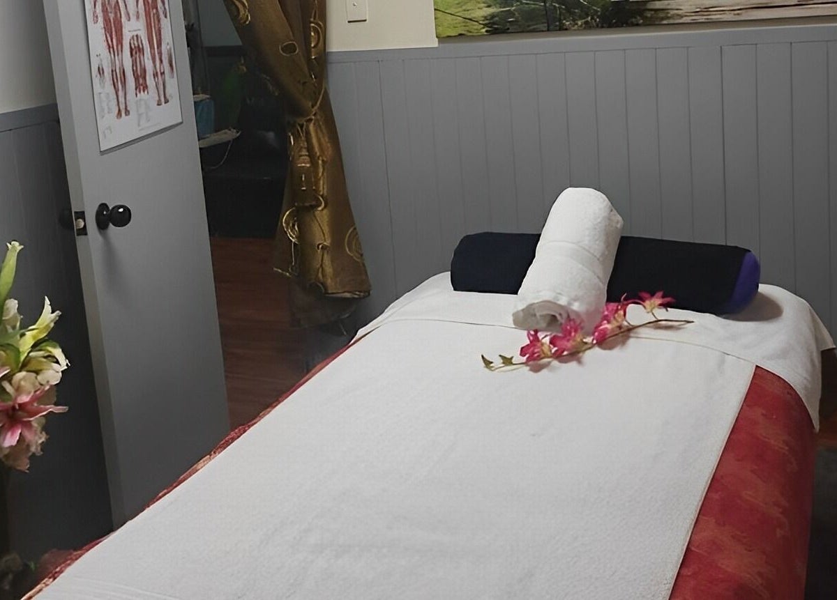 Relaxing massage room at Beyonder Relax and Wellness, Paradise Point, Queensland, AU with fresh flowers.