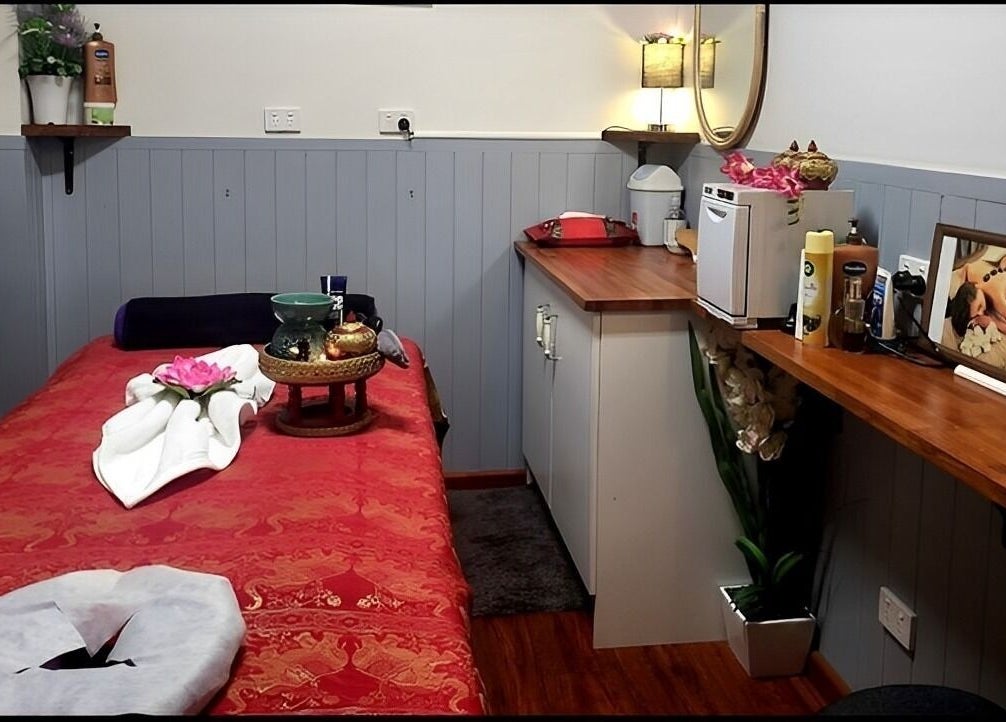 Cozy massage room at Beyonder Relax and Wellness in Paradise Point, Queensland, AU with warm lighting and decor.