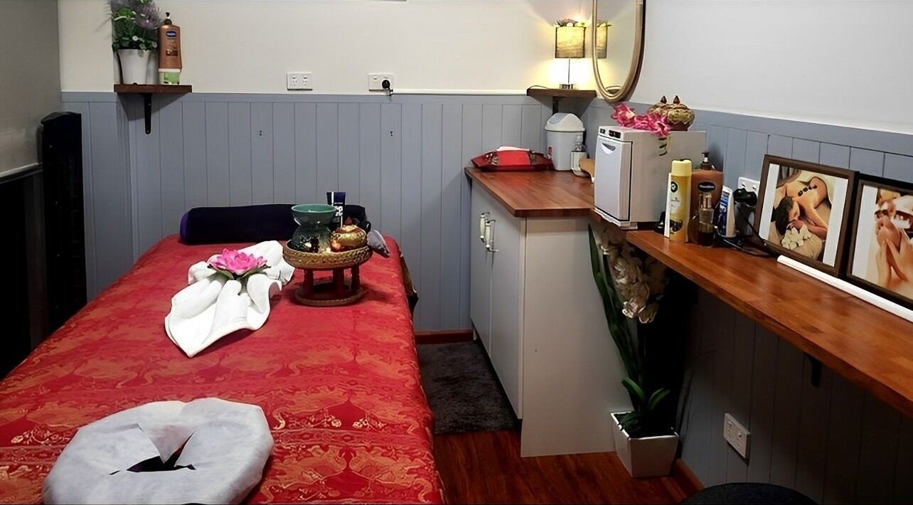 Cozy massage room at Beyonder Relax and Wellness in Paradise Point, Queensland, AU with warm lighting and decor.
