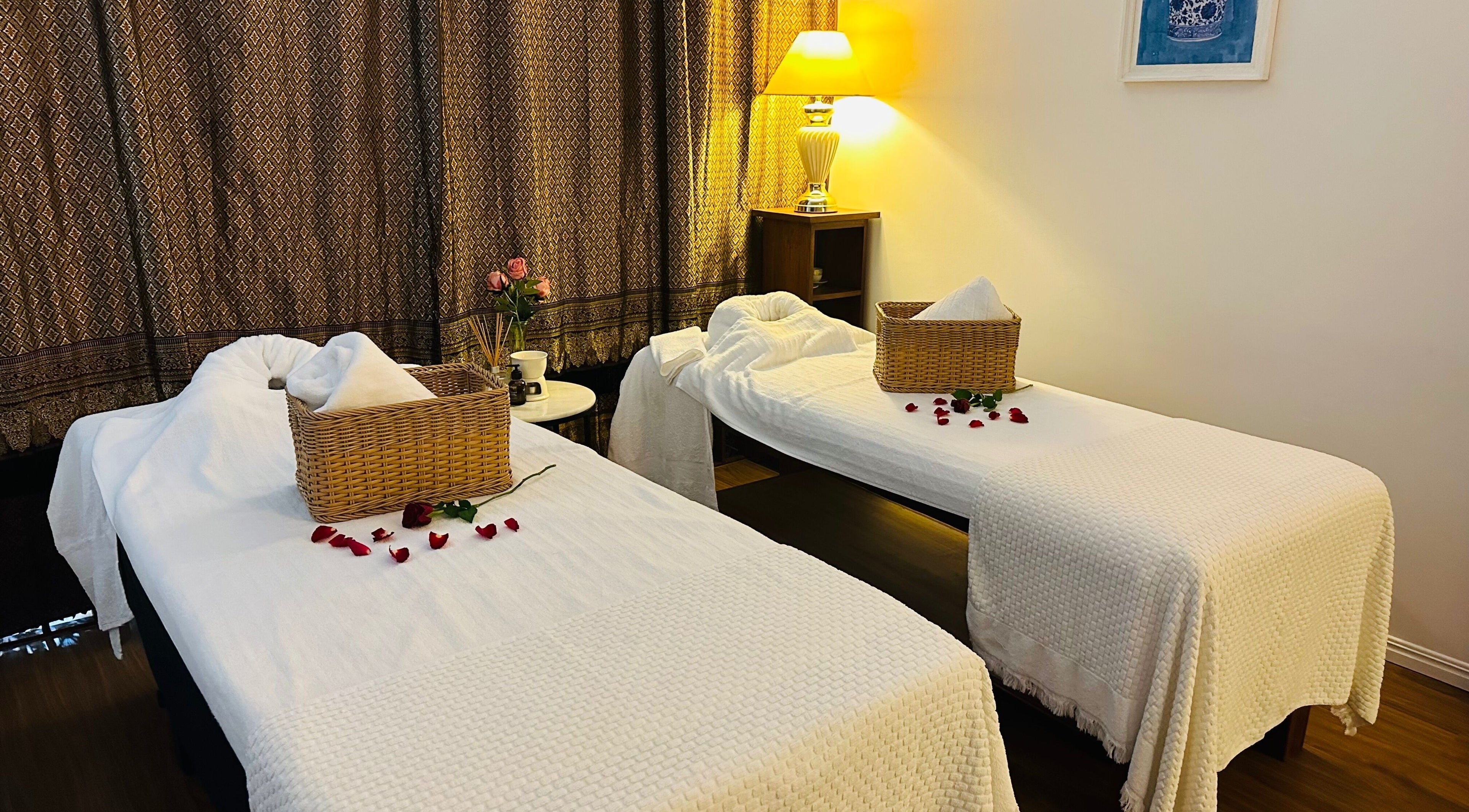 Relaxing massage room at Youi Thai Massage, New Farm, Queensland, AU with twin tables and ambiance lighting.