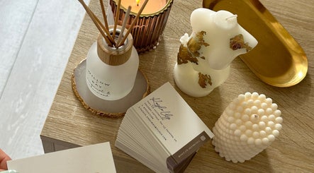 Stylish candles and business cards at Face Co Beauty and Aesthetics in Taunton, England, GB.