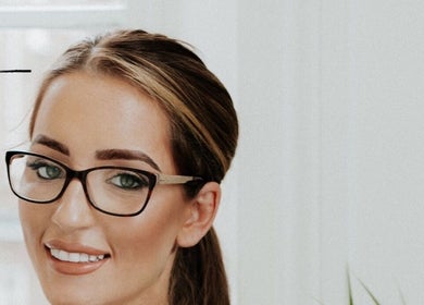 Professional at Face Co Beauty and Aesthetics, Taunton, England, GB, showcasing expertise and welcoming smile.