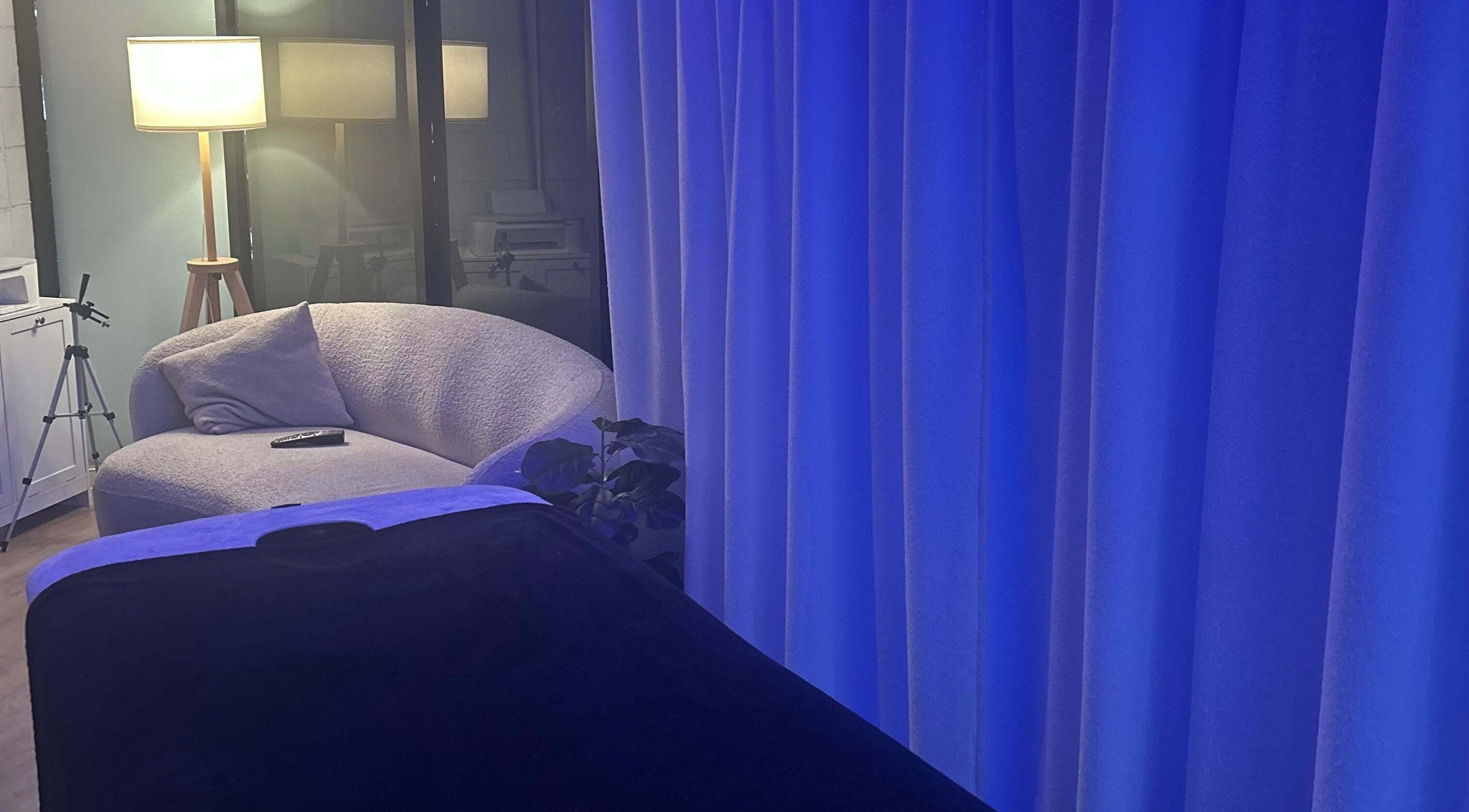 Relaxing lounge at Bodi Collective, Burleigh Heads, Queensland, AU with ambient lighting and cozy seating.