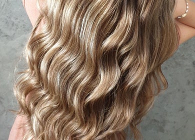 Long golden waves styled by Mariska J Hairstylist in Pretoria, Gauteng, ZA.