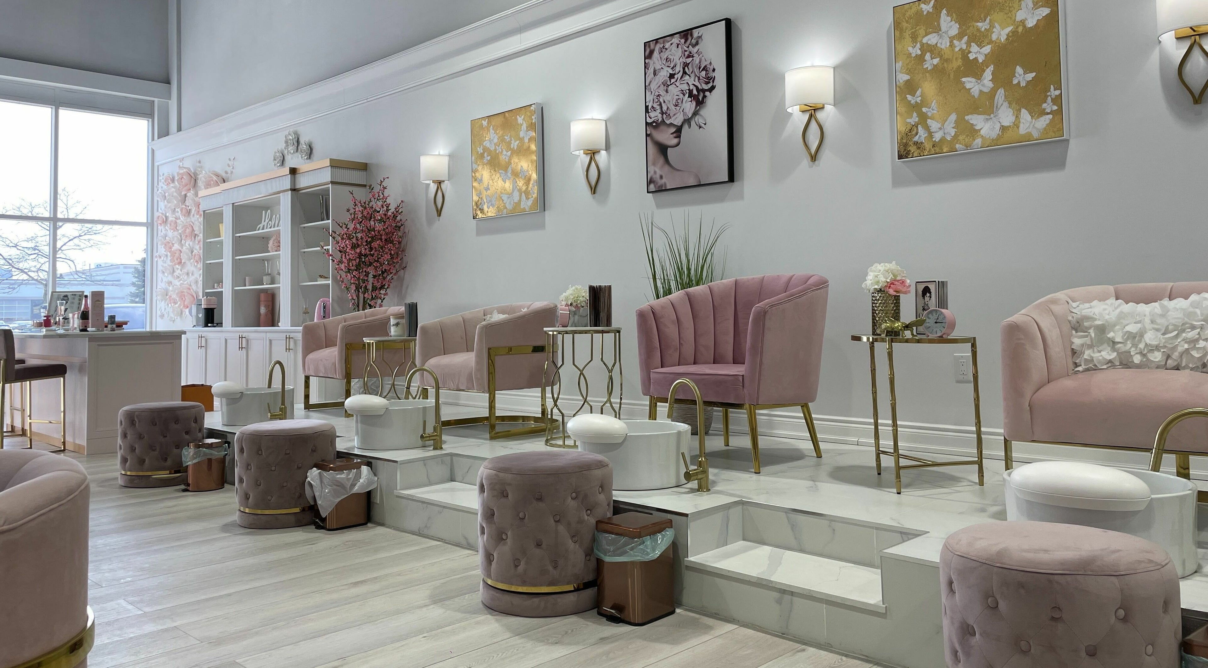 Chic interior of Nails a More Woodbridge, Vaughan, Ontario, CA, with plush pink seating and modern decor.
