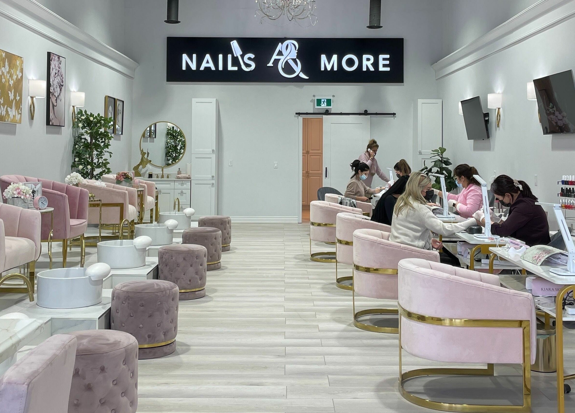 Luxurious interior of Nails a More Woodbridge, Vaughan, Ontario, CA, with plush seating and elegant design.