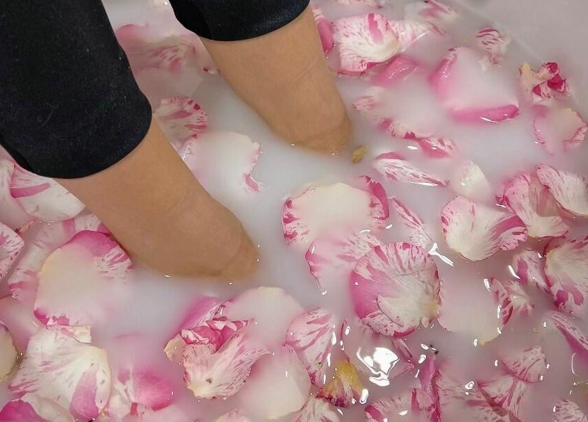 Feet soaking in a rose petal milk bath at Nails a More Woodbridge, Vaughan, Ontario, CA.