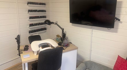 Manicure station at Brooke’s House of Beauty in Dundee, Scotland, GB featuring nail polish shelves and comfy seating.