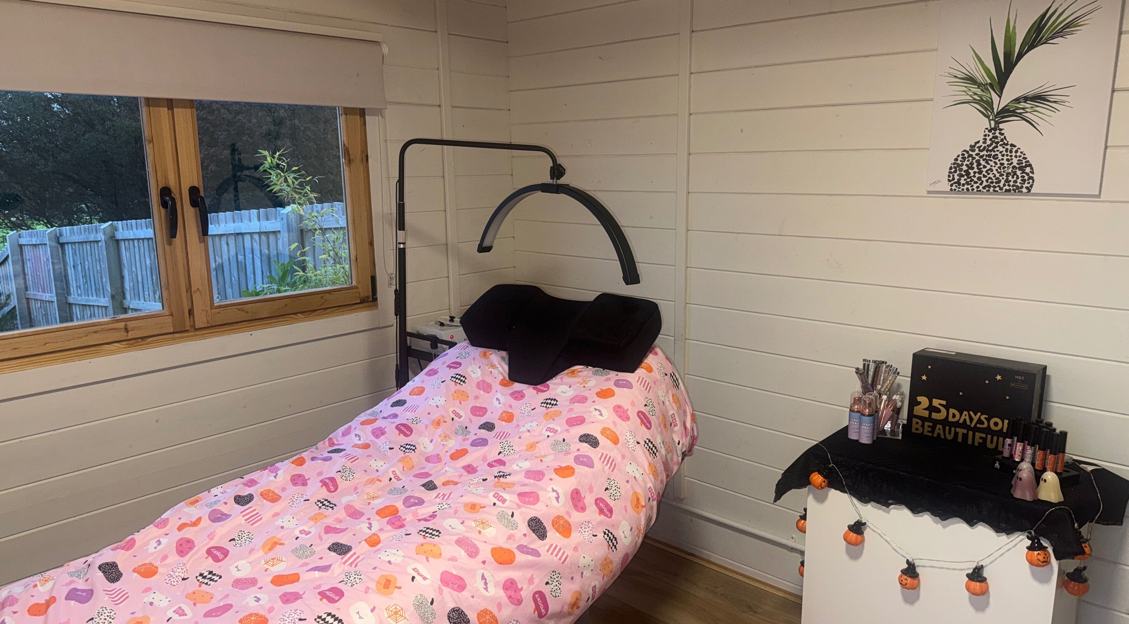 Relaxing treatment room at Brooke’s House of Beauty, Dundee, Scotland, GB with a cozy bed and decorative details.