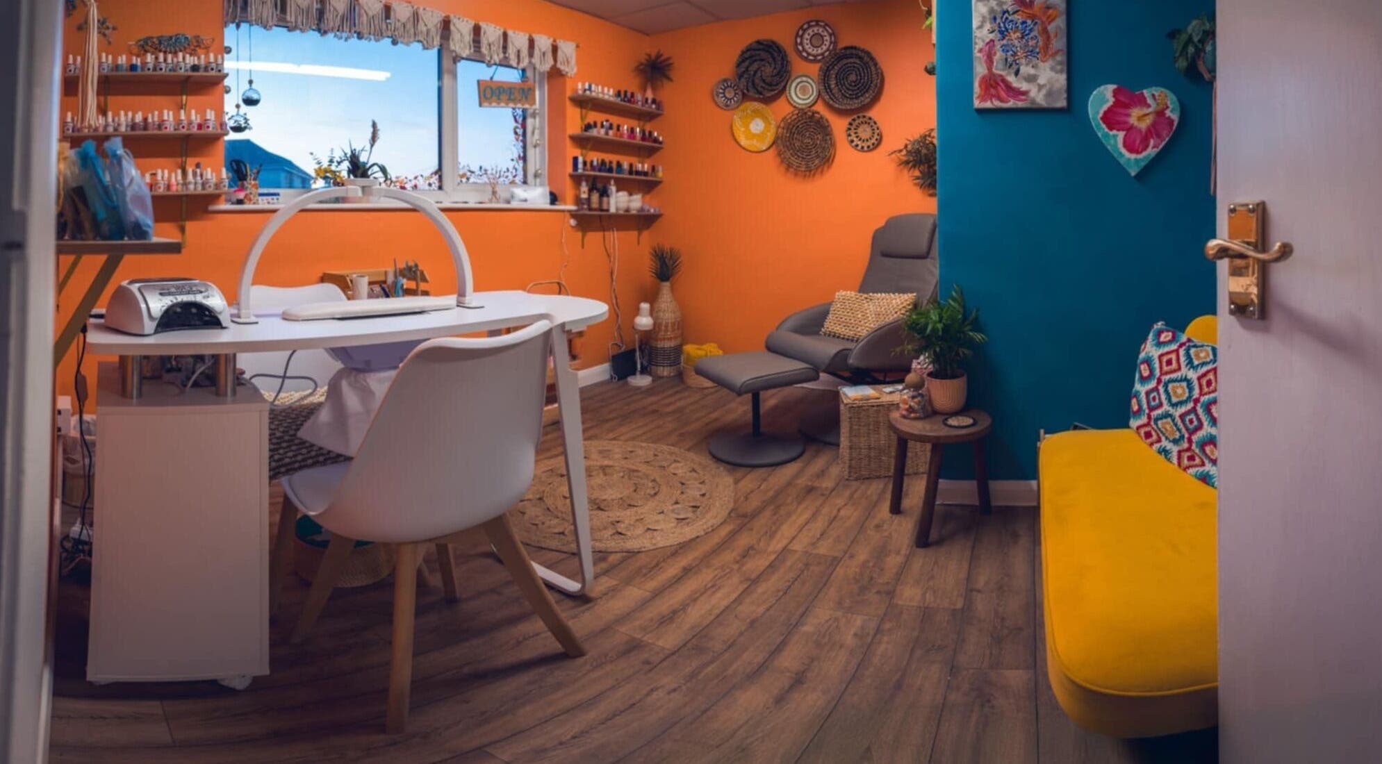Bright, colorful interior of Ocean Nails Studio in Northam, England, GB with modern decor and nail polishes.