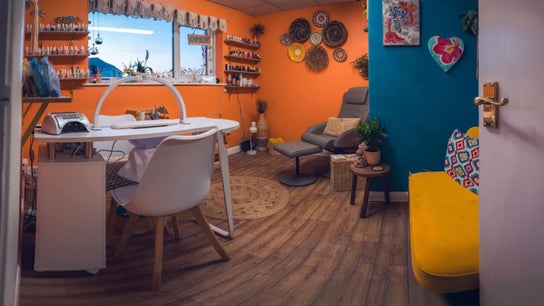 Bright, colorful interior of Ocean Nails Studio in Northam, England, GB with modern decor and nail polishes.