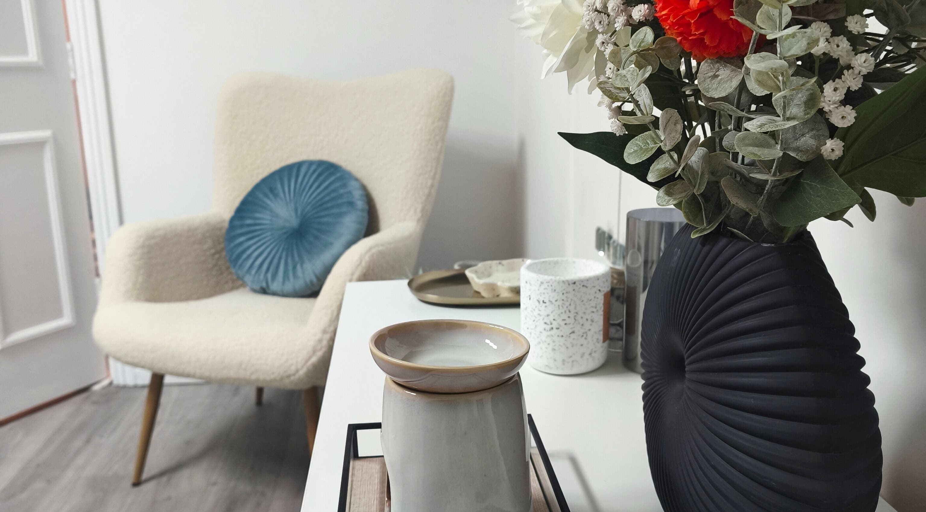 Cozy chair and floral decor at Sarah Dinan Nails in Ennis, County Clare, IE.