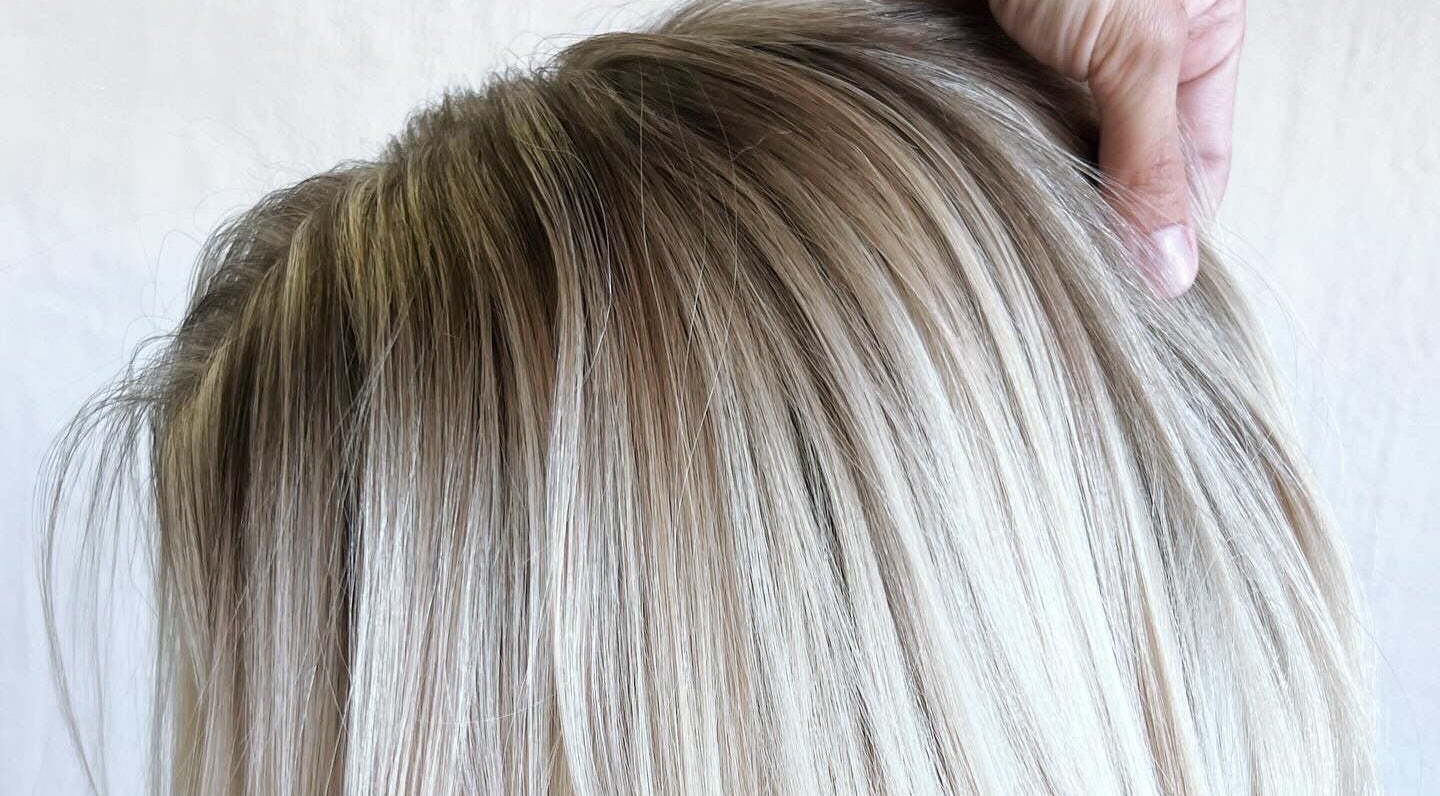 Stylish blonde hair close-up at Alchemy Hair Studio in Somerset West, Western Cape, ZA.