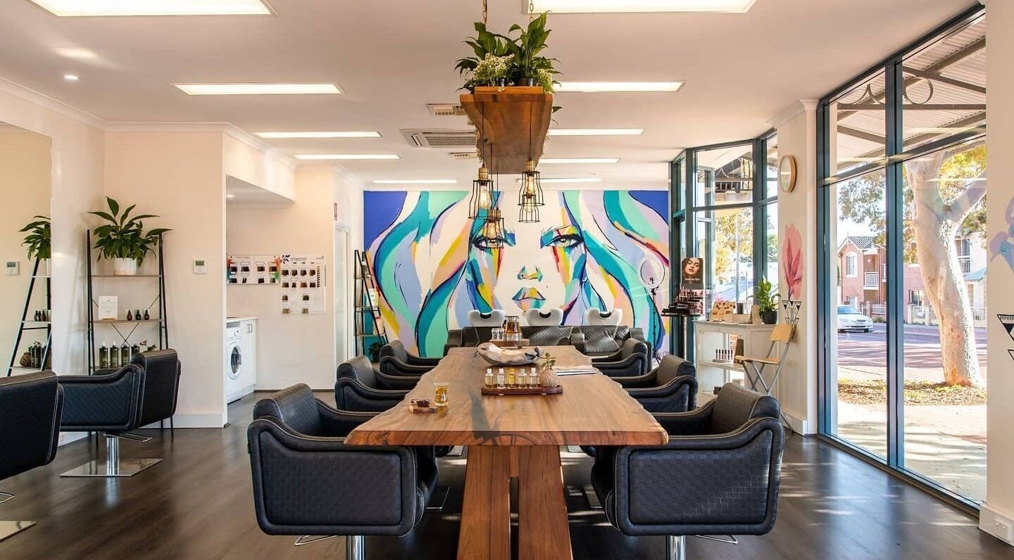 Interior of Supernatural Beauty in Joondalup, Western Australia, AU, showcasing modern styling chairs and vivid artwork.