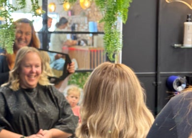 Smiling client in THE GLOSS salon, Lowestoft, England, GB, enjoying a session.