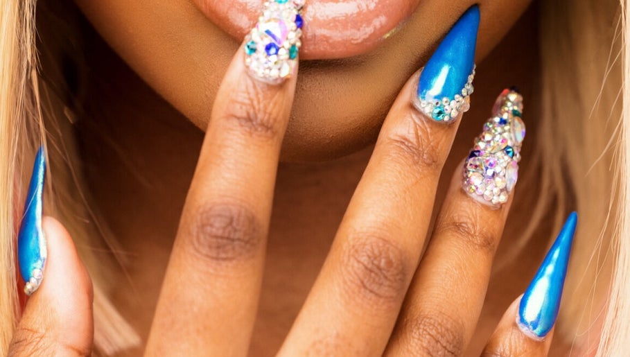 Stylish blue and gem nail art at Brown Sugar Nail Spa SUITE, Philadelphia, Pennsylvania, US.