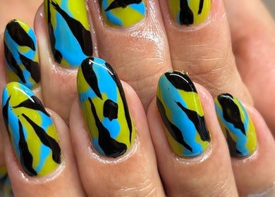 Bold nail art in blue, green, and black at Brown Sugar Nail Spa SUITE, Philadelphia, Pennsylvania, US.