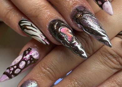 Intricate nail art at Brown Sugar Nail Spa SUITE, Philadelphia, Pennsylvania, US showcasing unique designs.