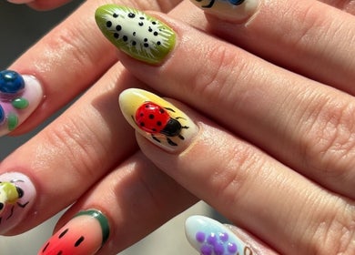 Intricate nail art at Brown Sugar Nail Spa SUITE, Philadelphia, Pennsylvania, US showcases vibrant designs.