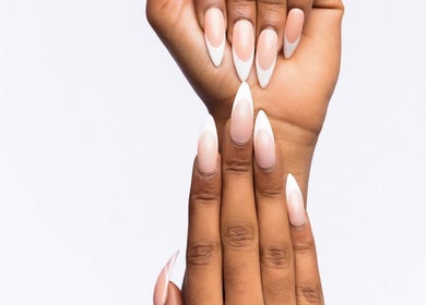 Elegant stiletto nails featuring French tips at Brown Sugar Nail Spa **SUITE** in Philadelphia, Pennsylvania, US.