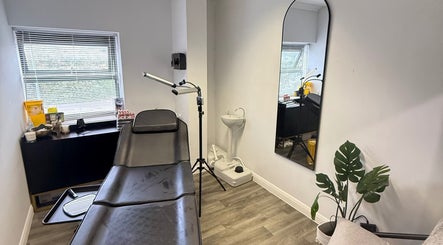 Modern beauty treatment room at Tweak Clinic, Peterborough, England, GB with sleek design and cozy ambiance.