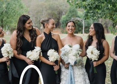 Bridal party smiling with bouquets at Apricot Road Luxury Spray Tanning, Eglinton, Western Australia, AU.