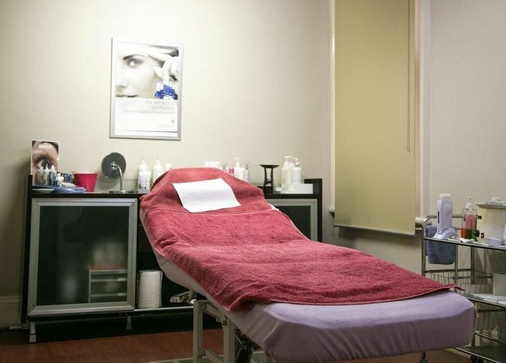 Cozy treatment room at Carpe Diem Studio, Melbourne, Victoria, AU with a red-towel massage table.