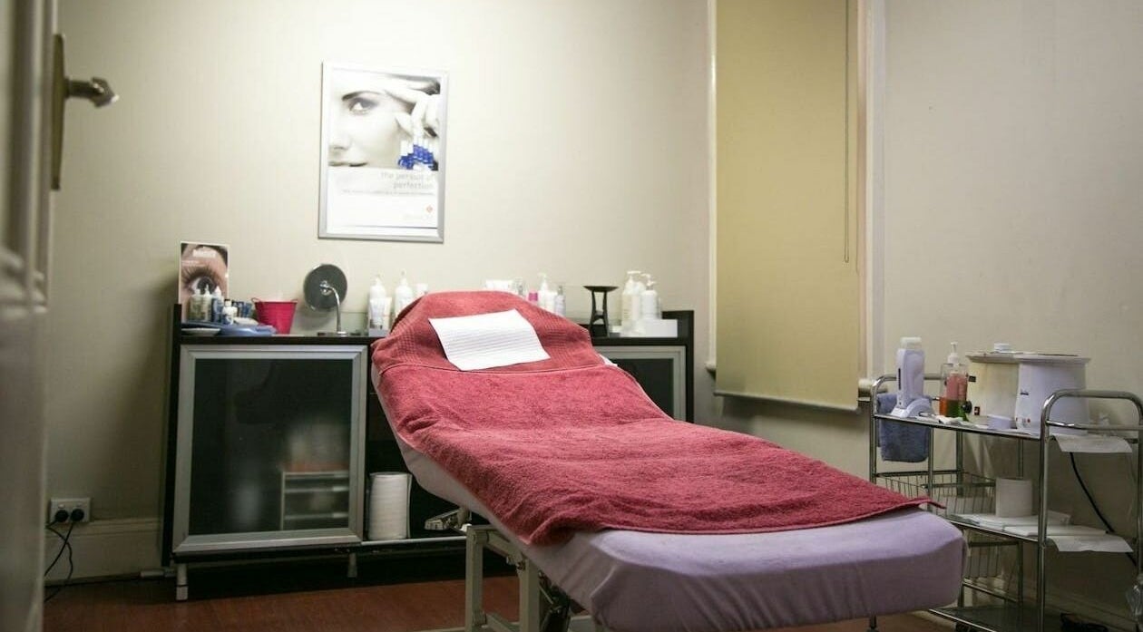 Cozy treatment room at Carpe Diem Studio, Melbourne, Victoria, AU with a red-towel massage table.